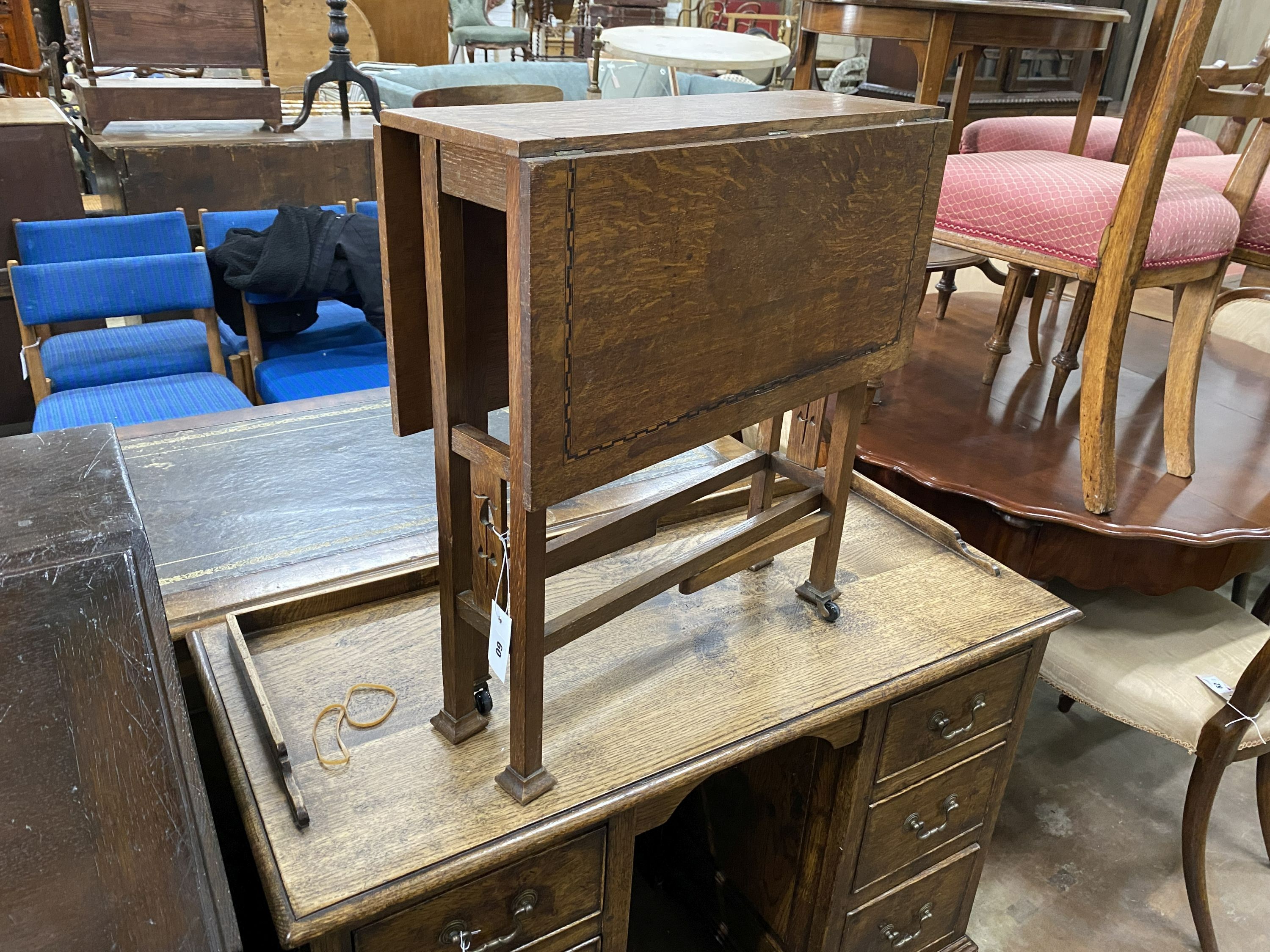 An Arts & Crafts inlaid oak Sutherland table, width 56cm, depth 19cm, height 61cm